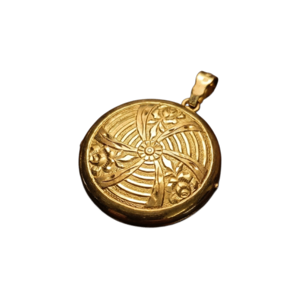 Vintage 18k keltakultainen medaljonki, kohokuvioitu etupinta ja sileä takapinta, halkaisija 33 mm.