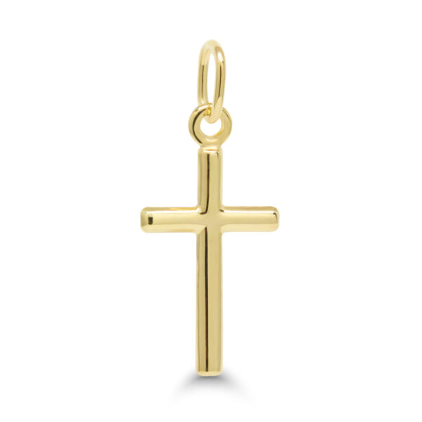 Siro ja pelkistetty keltakultainen ristiriipus sileällä pinnalla